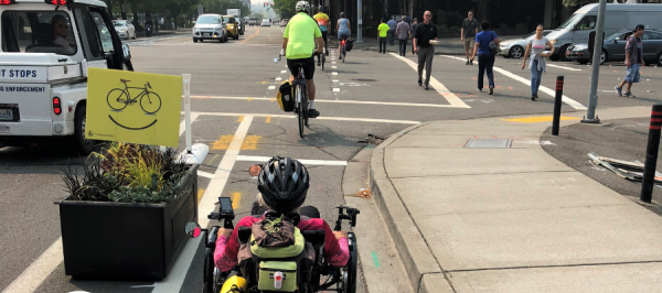 People biking in bike lane
