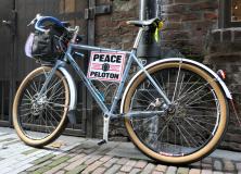 Bike with Peace Peleton sign